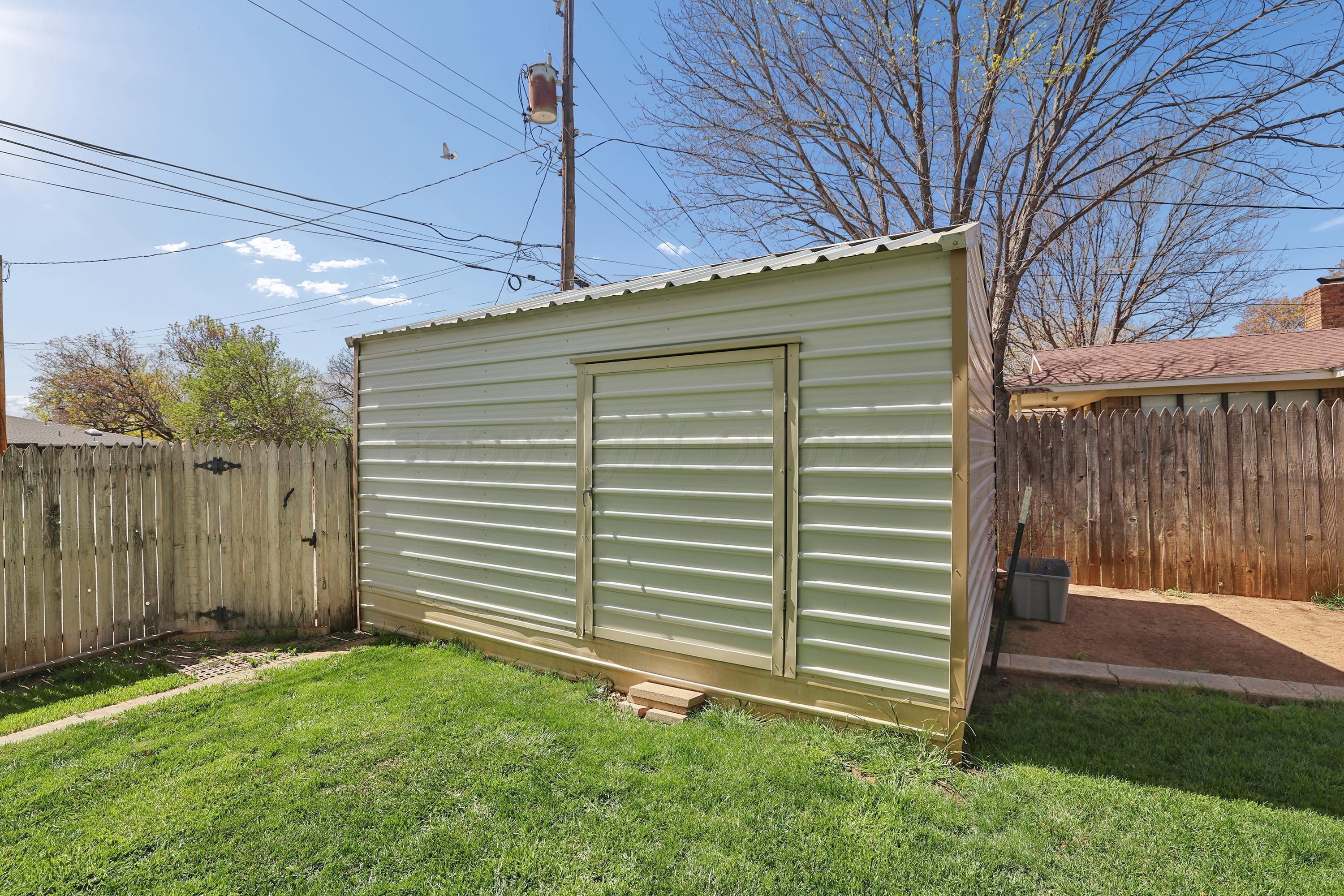 7903 Fenley Drive Amarillo, TX 79121 - Photo 6 of 20 a view of a backyard with plants and a backyard