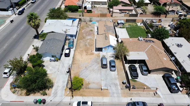 an aerial view of residential houses with outdoor space