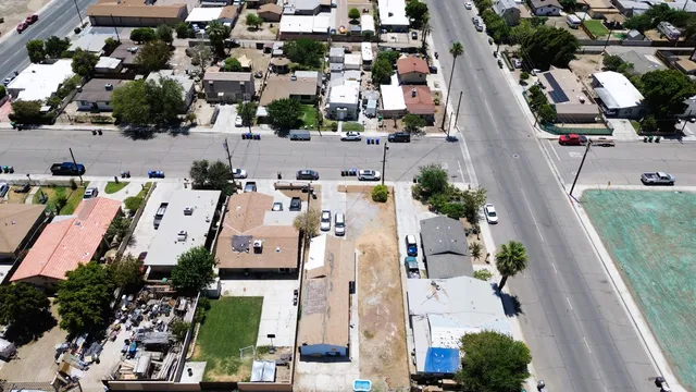an aerial view of residential houses with outdoor space