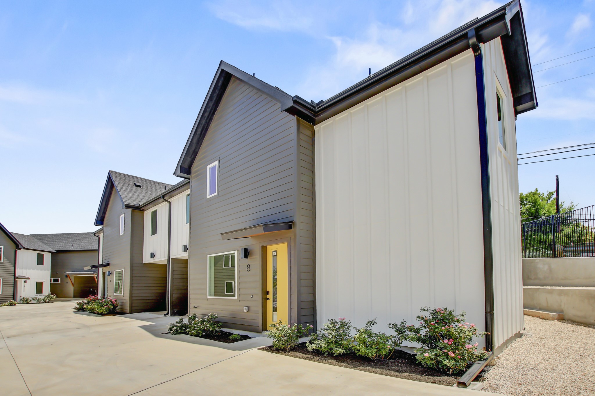 4127 East 12th Street, Unit 8 Austin, TX 78721 - Photo 30 of 32 a front view of a house with a yard