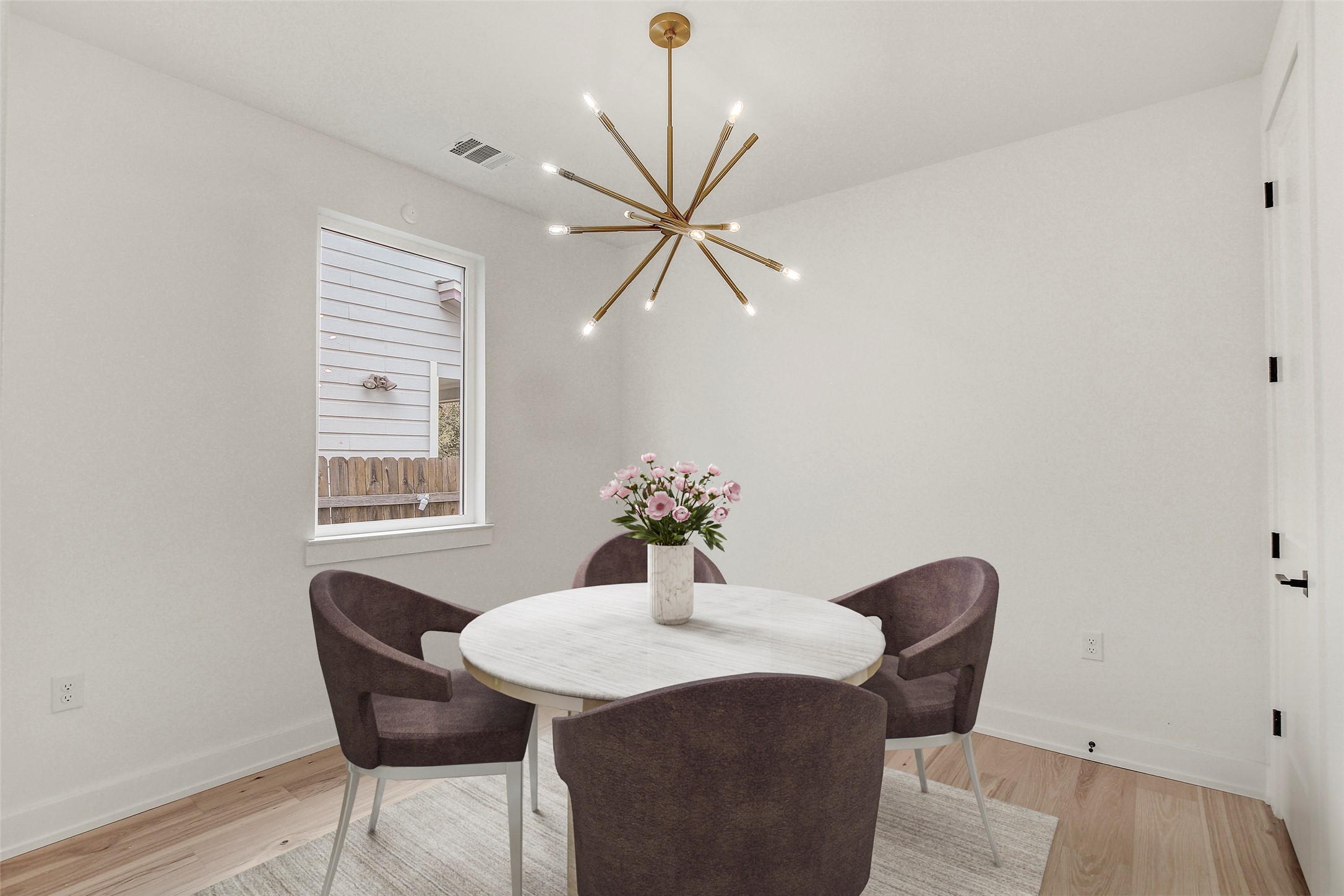 4127 East 12th Street, Unit 8 Austin, TX 78721 - Photo 3 of 32 a dining room with furniture and window