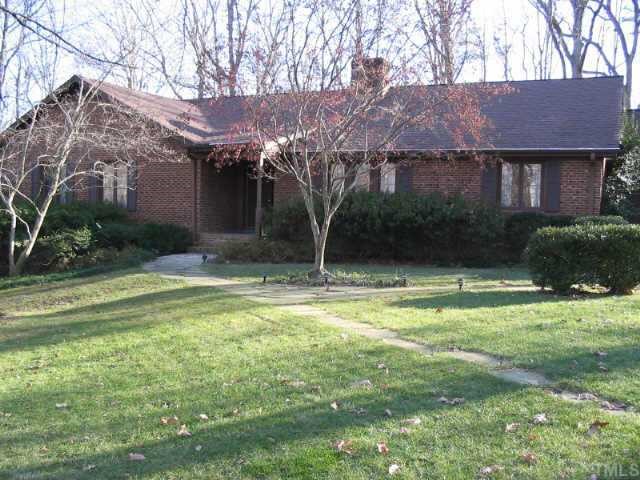 5021 Springwood Drive Raleigh, NC 27613 - Photo 1 of 1 a backyard of a house with lots of green space and fountain