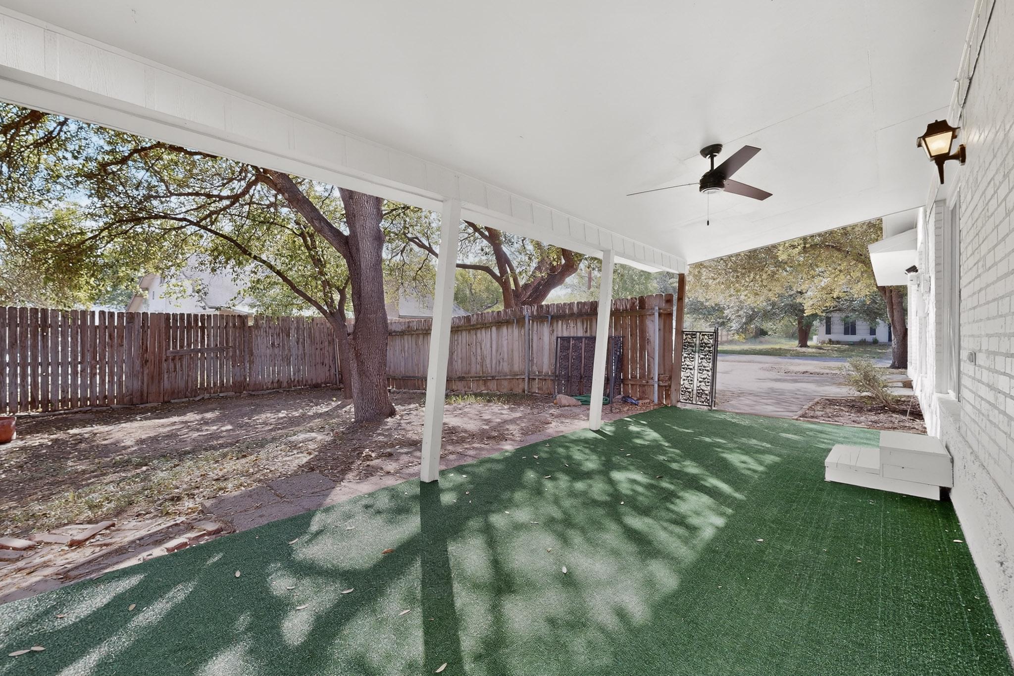 812 George Street Taylor, TX 76574 - Photo 19 of 34 Fenced backyard featuring ceiling fan and a patio