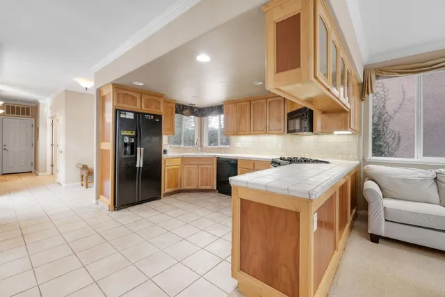 a view of a dining room with furniture window and outside view