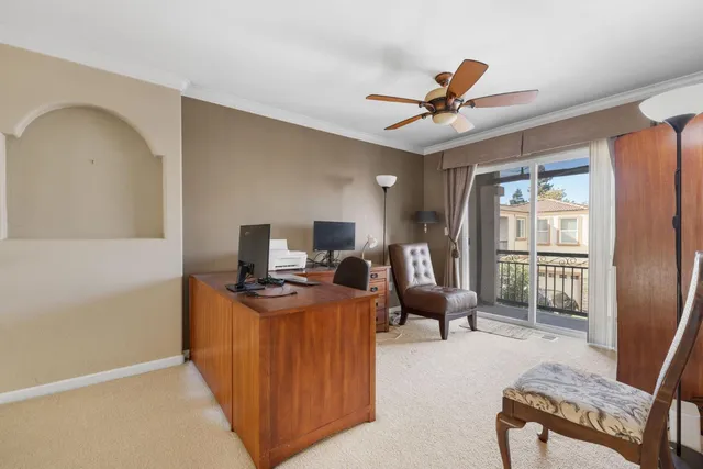 a view of a workspace with furniture