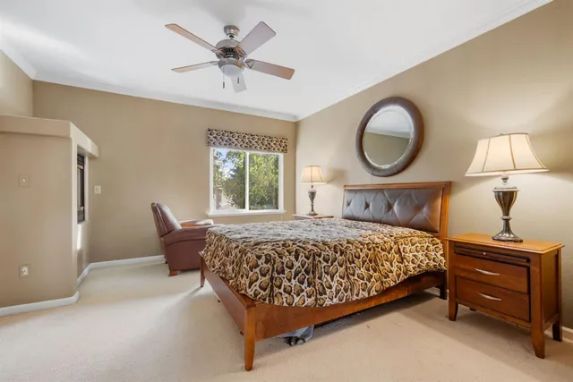 a bedroom with a bed and closet with mirror