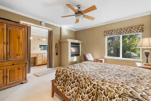 a spacious bathroom with a granite countertop sink mirror and a bathtub