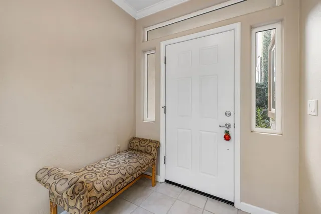 a living room with a flat screen tv and a fireplace