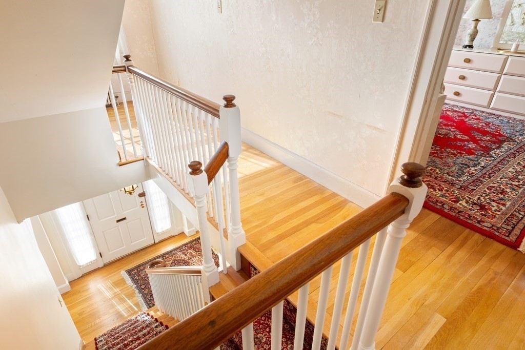 7 Gordon Road Milton, MA 02186 - Photo 11 of 17 a view of stairs and living room