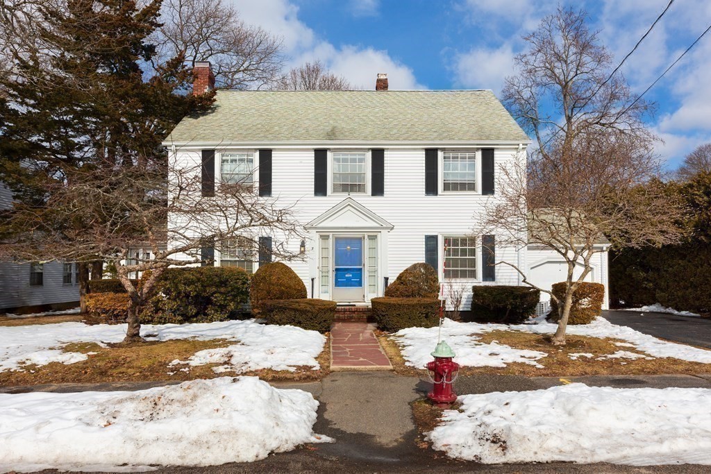 7 Gordon Road Milton, MA 02186 - Photo 13 of 17 a front view of a house with a yard covered in snow