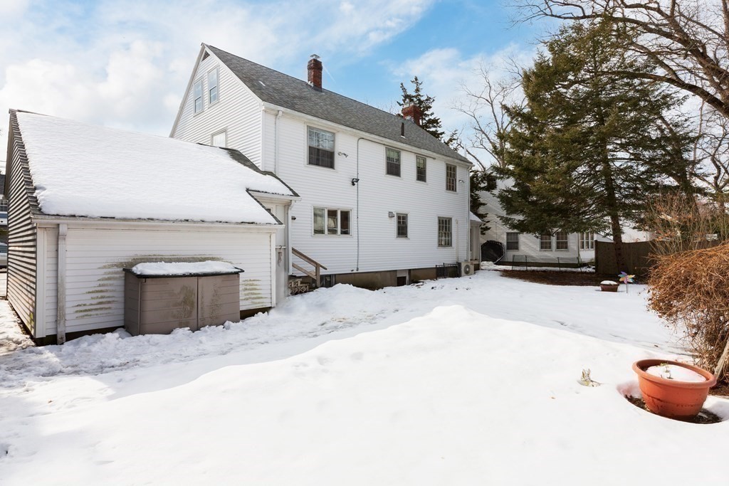 7 Gordon Road Milton, MA 02186 - Photo 14 of 17 a view of a white house with a yard