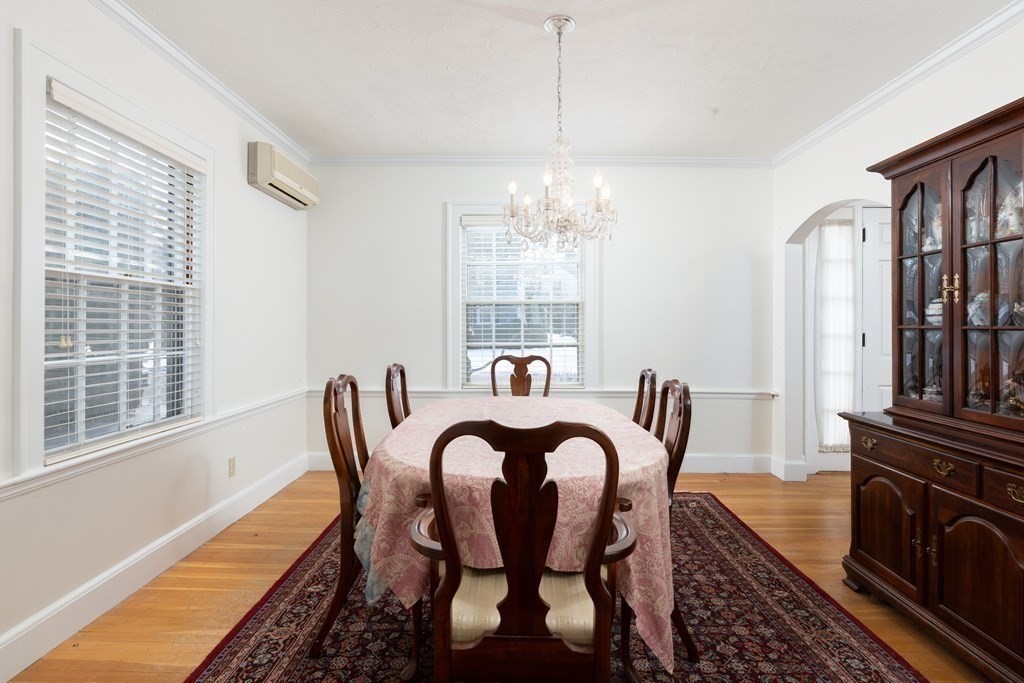 7 Gordon Road Milton, MA 02186 - Photo 16 of 17 a view of a dining room with furniture a chandelier and wooden floor