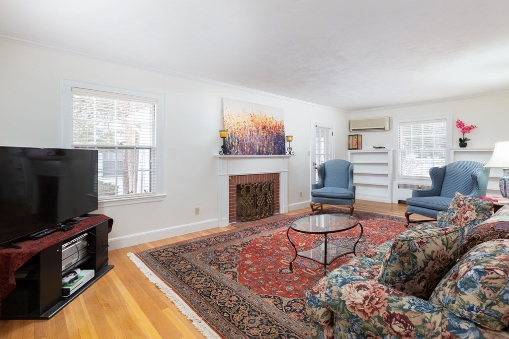 7 Gordon Road Milton, MA 02186 - Photo 3 of 17 a living room with furniture and a flat screen tv