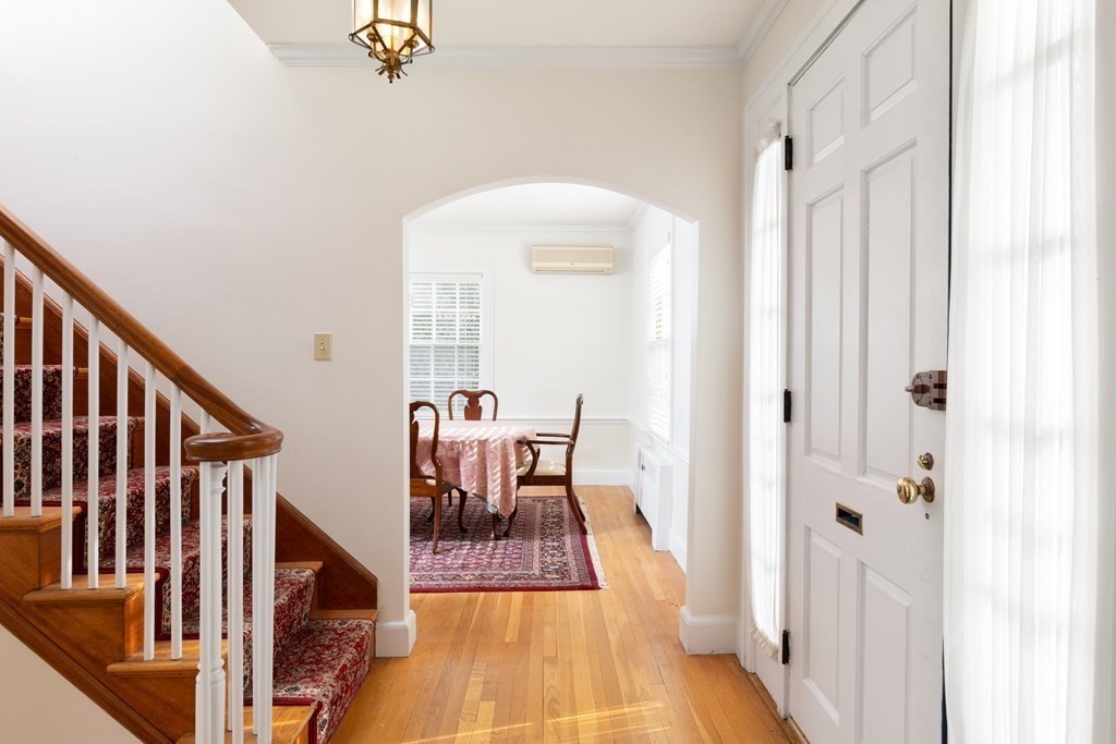 7 Gordon Road Milton, MA 02186 - Photo 10 of 17 a view of a hallway with wooden floor and staircase
