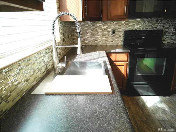 a view of a living room with a fireplace