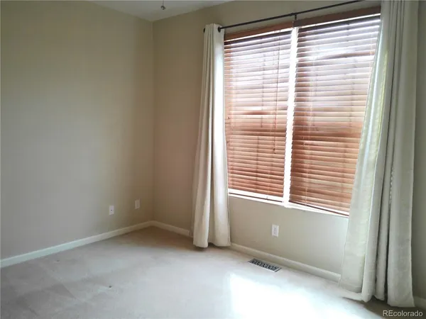 a view of a bathroom from a corridor