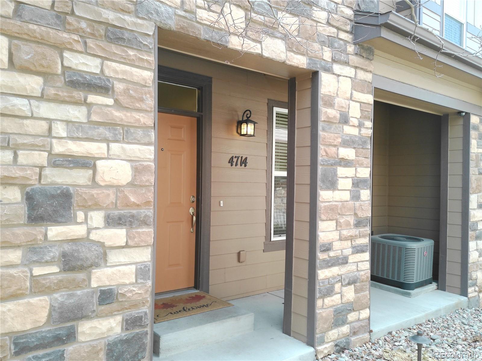 4714 ROWLAND Heights Colorado Springs, CO 80923 - Photo 2 of 41 a view of a bathroom with a glass door