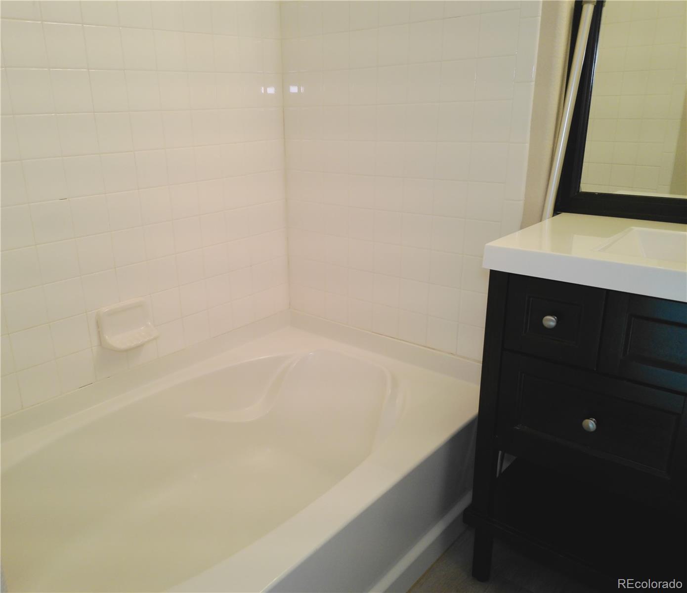 4714 ROWLAND Heights Colorado Springs, CO 80923 - Photo 22 of 41 a bathroom with a bathtub