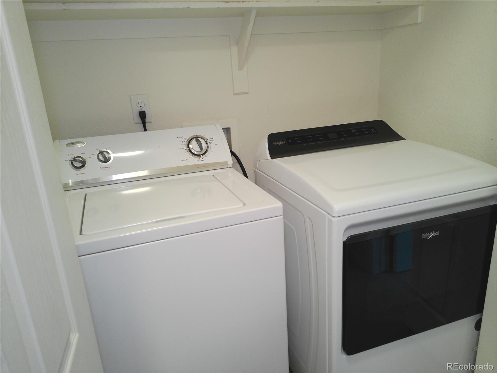 4714 ROWLAND Heights Colorado Springs, CO 80923 - Photo 28 of 41 a utility room with dryer and washer