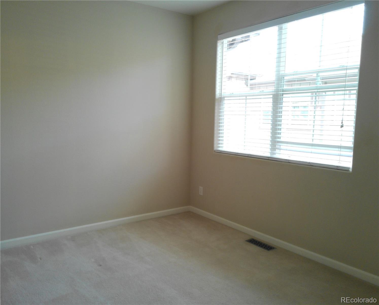 4714 ROWLAND Heights Colorado Springs, CO 80923 - Photo 29 of 41 an empty room with a window