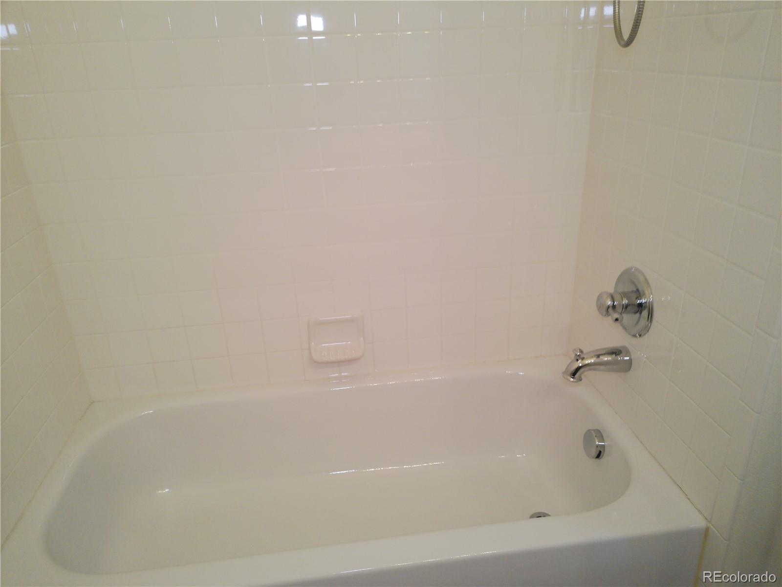 4714 ROWLAND Heights Colorado Springs, CO 80923 - Photo 33 of 41 a close up of a bathtub