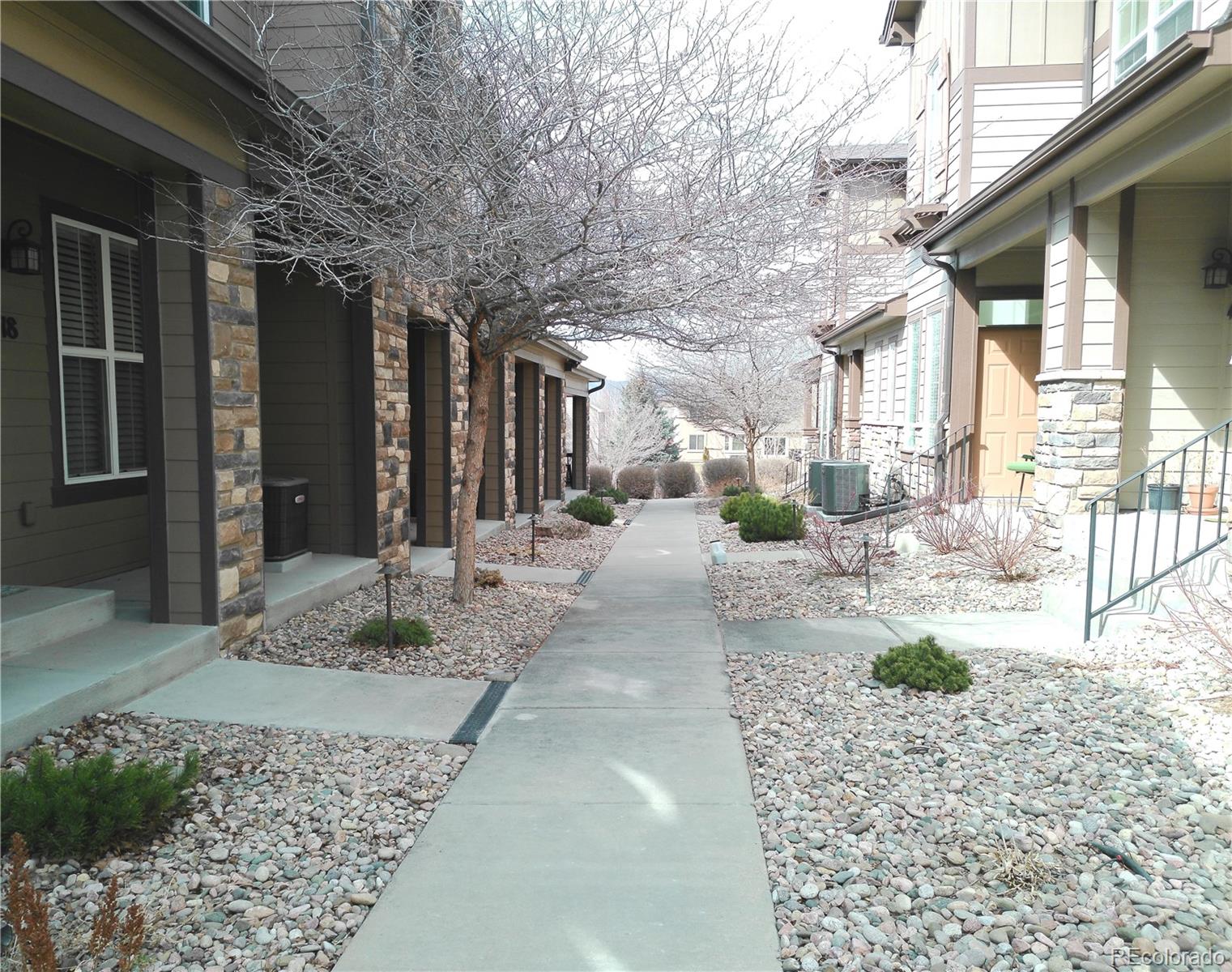 4714 ROWLAND Heights Colorado Springs, CO 80923 - Photo 37 of 41 a view of a porch with chairs