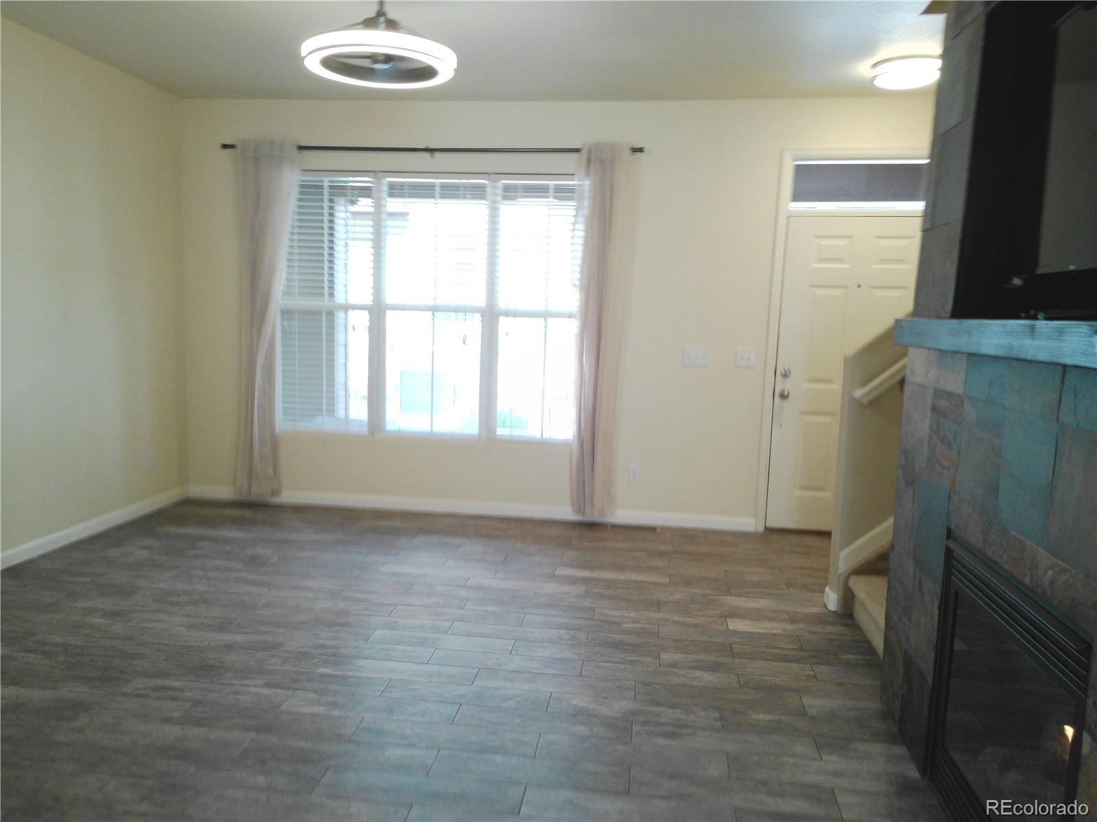 4714 ROWLAND Heights Colorado Springs, CO 80923 - Photo 7 of 41 a view of an empty room with a window