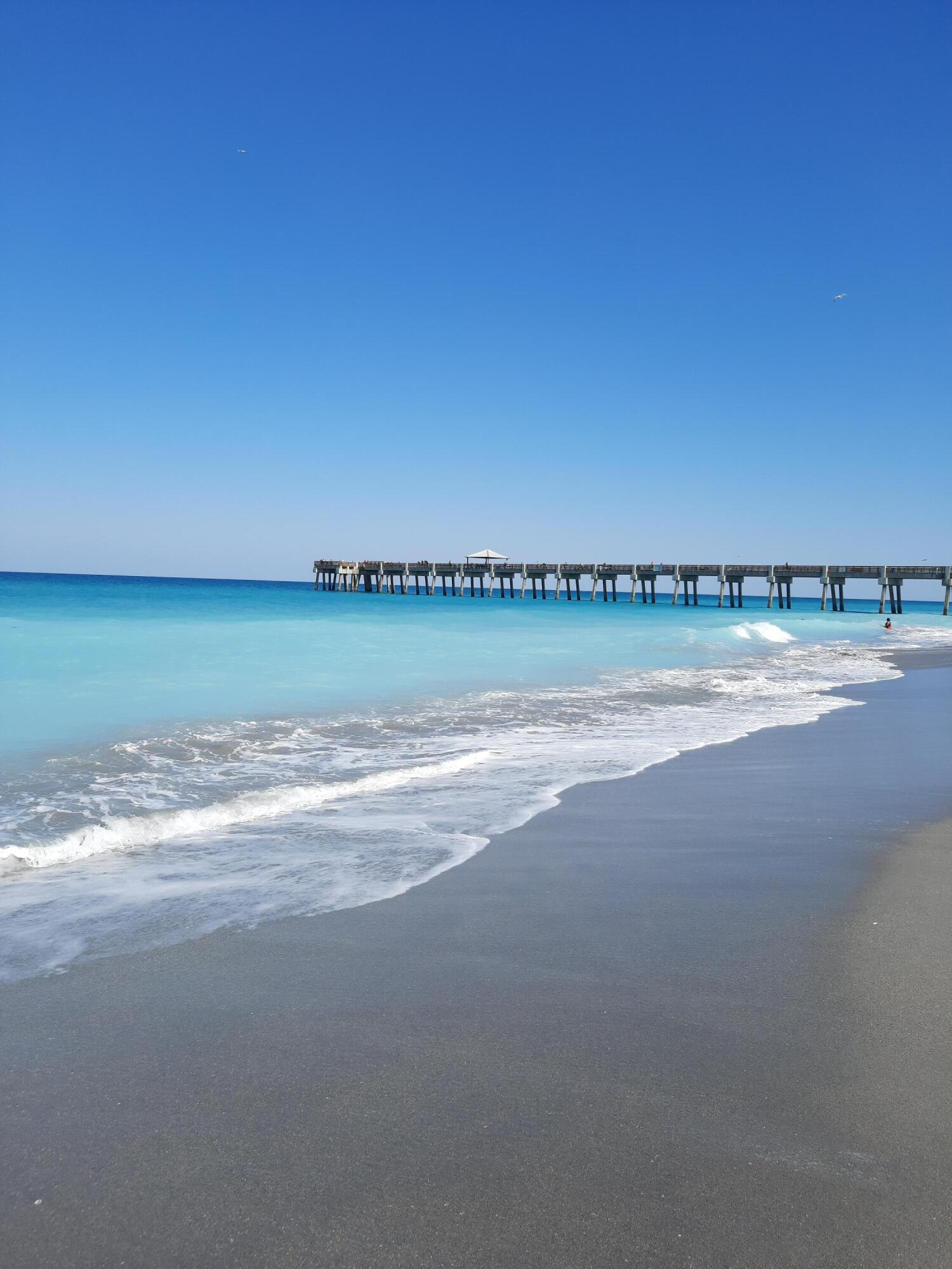 1206 Mainsail Circle Jupiter, FL 33477 - Photo 4 of 7 a view of an ocean and beach