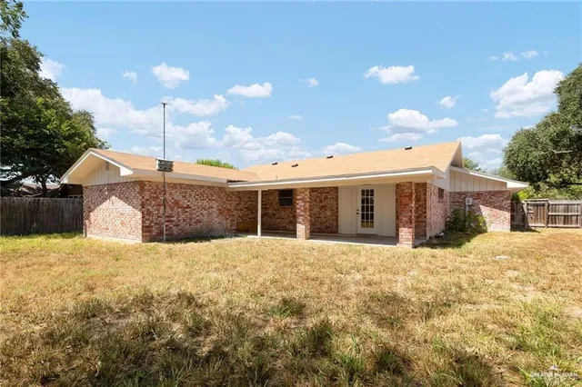 an aerial view of residential house with outdoor space and swimming pool