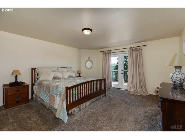 a bedroom with furniture and a window