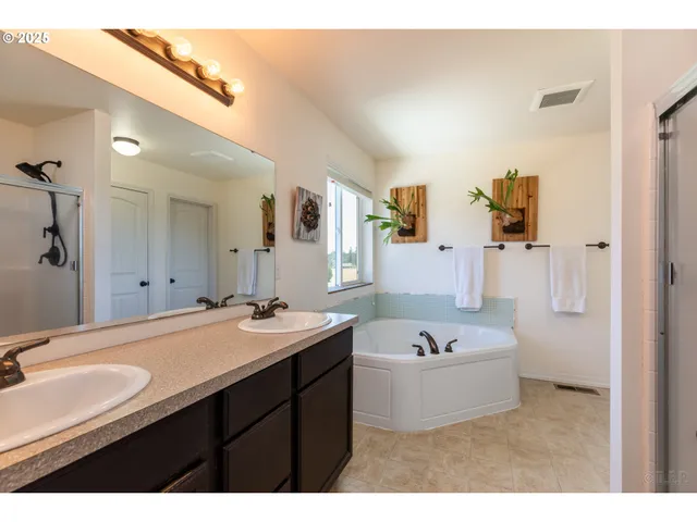 a bathroom with a sink a mirror and a bathtub