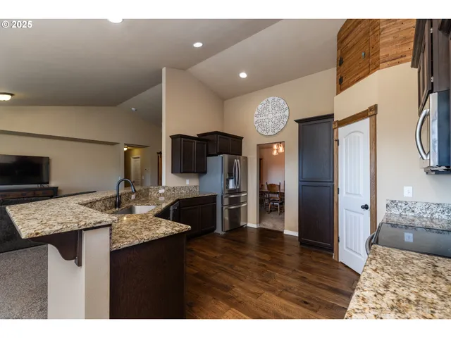 a view of kitchen and dining area with furniture