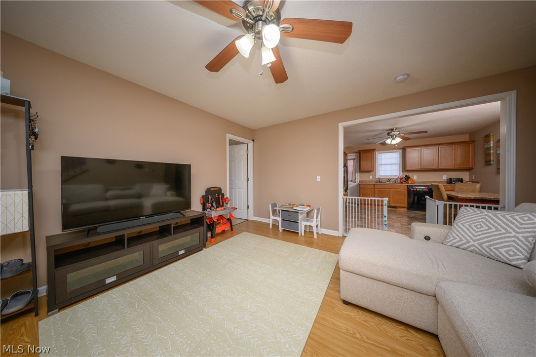 4431 7th Street Northwest Canton, OH 44708 - Photo 2 of 23 Living room with light wood-style floors and ceiling fan