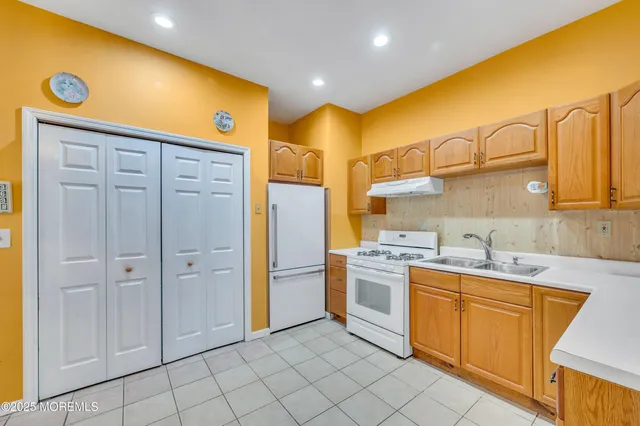 a bathroom with a sink a washer and dryer