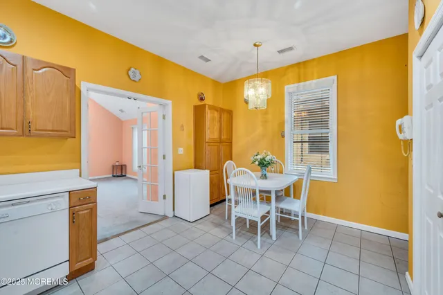 a view of a dining room with furniture and window