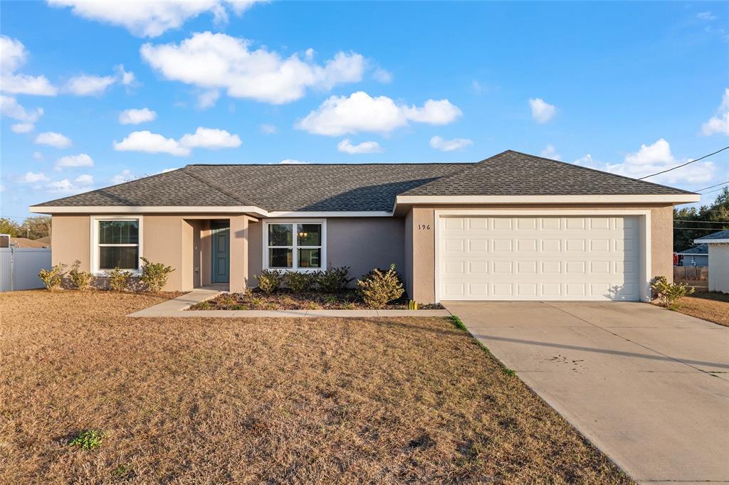 196 Willow Road Ocala, FL 34472 - Photo 1 of 1 a front view of a house with a yard