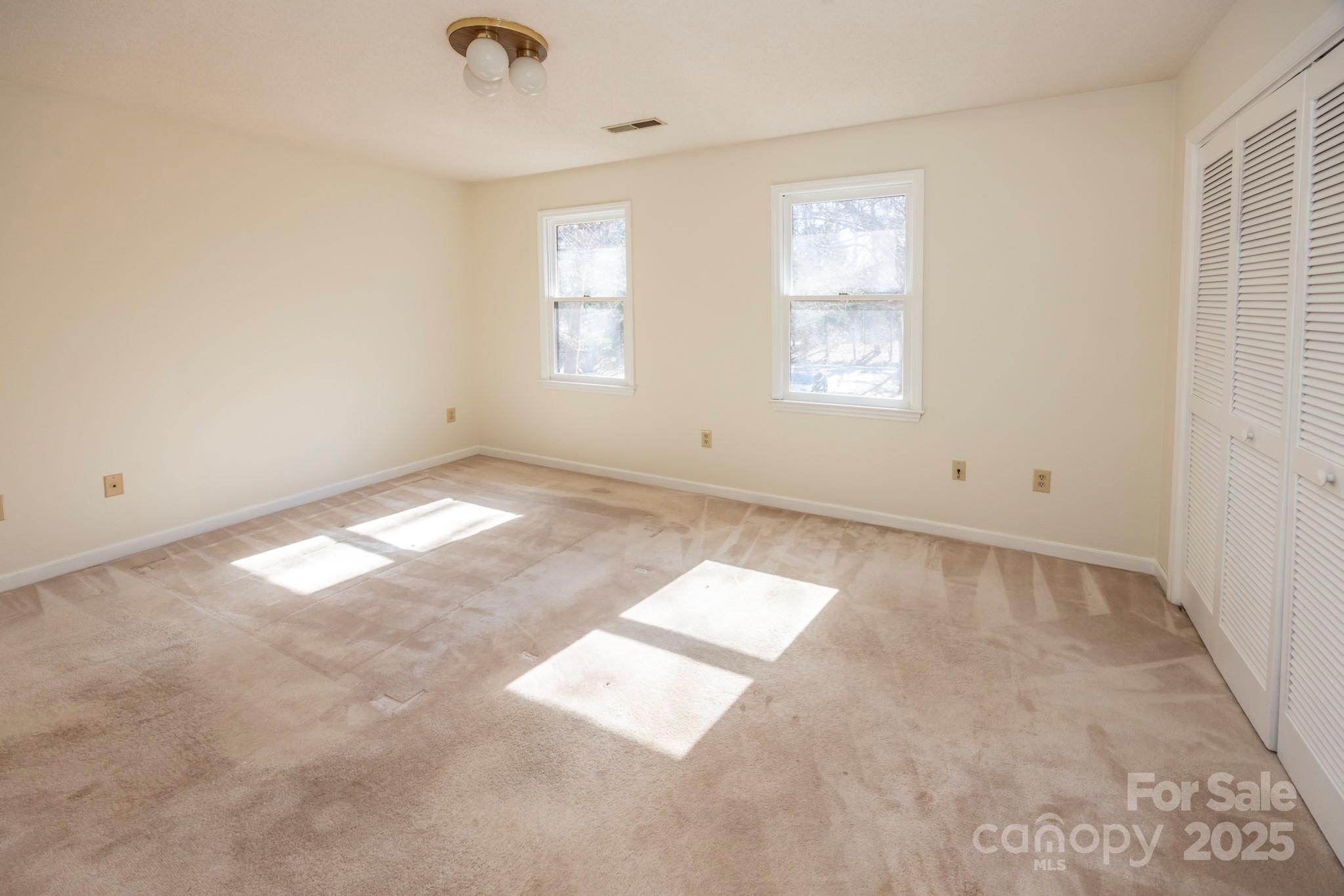 395 Thompson Road Rutherfordton, NC 28139 - Photo 12 of 25 an empty room with windows