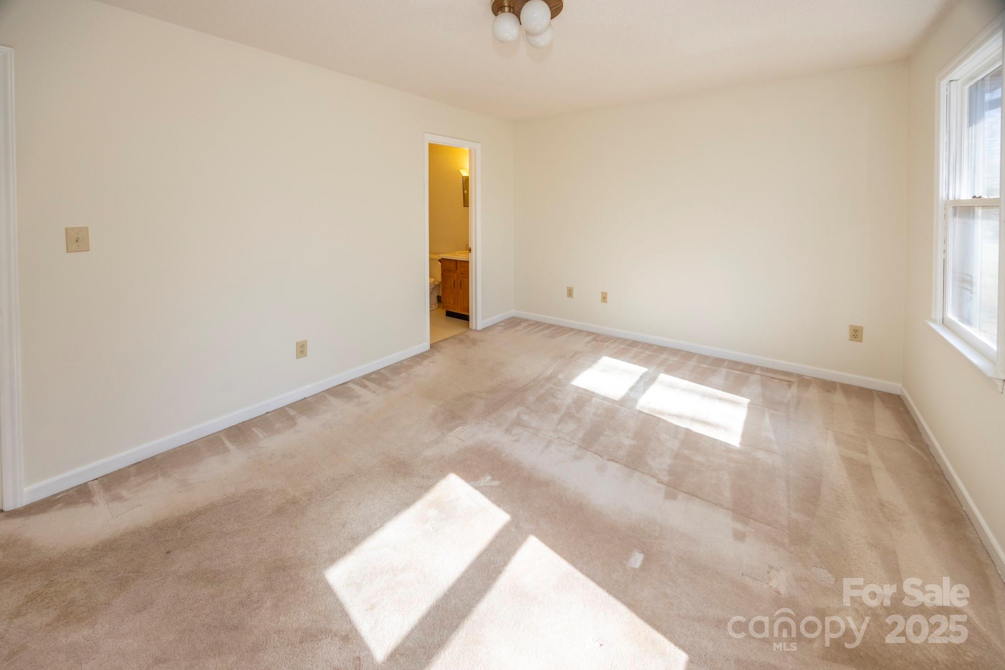 395 Thompson Road Rutherfordton, NC 28139 - Photo 13 of 25 an empty room with windows