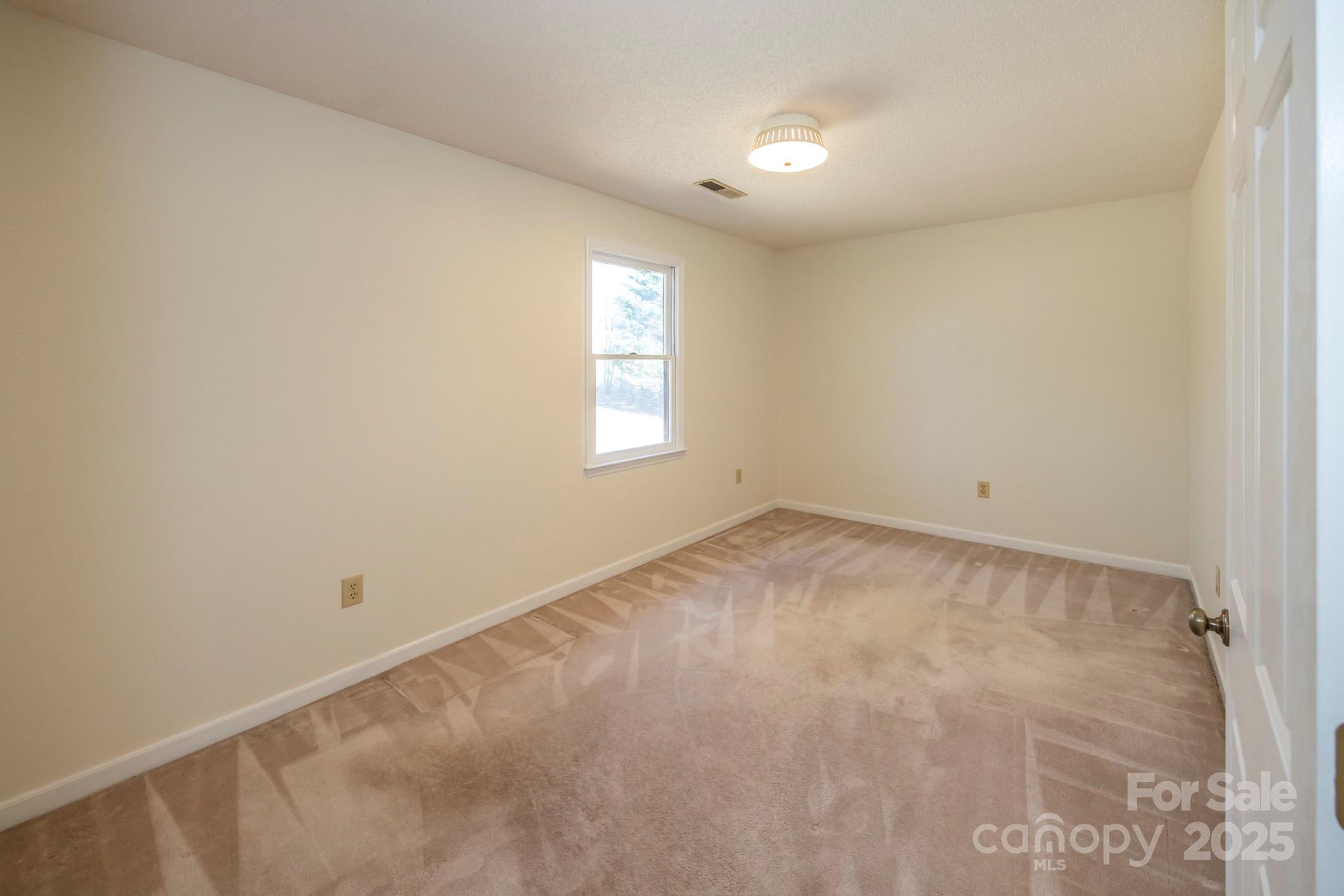 395 Thompson Road Rutherfordton, NC 28139 - Photo 15 of 25 an empty room with a window