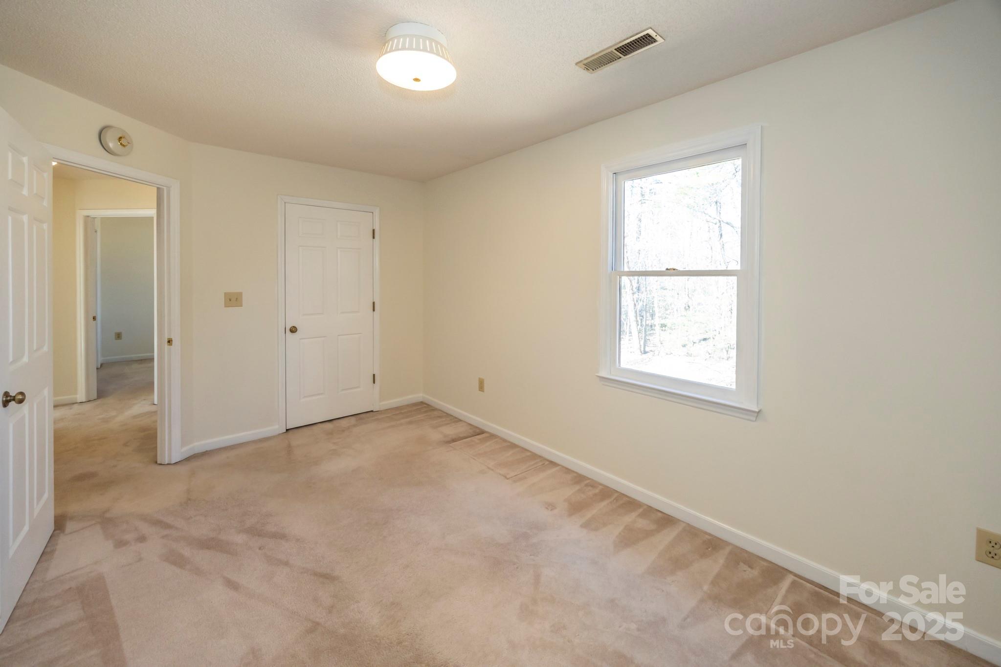 395 Thompson Road Rutherfordton, NC 28139 - Photo 16 of 25 an empty room with windows