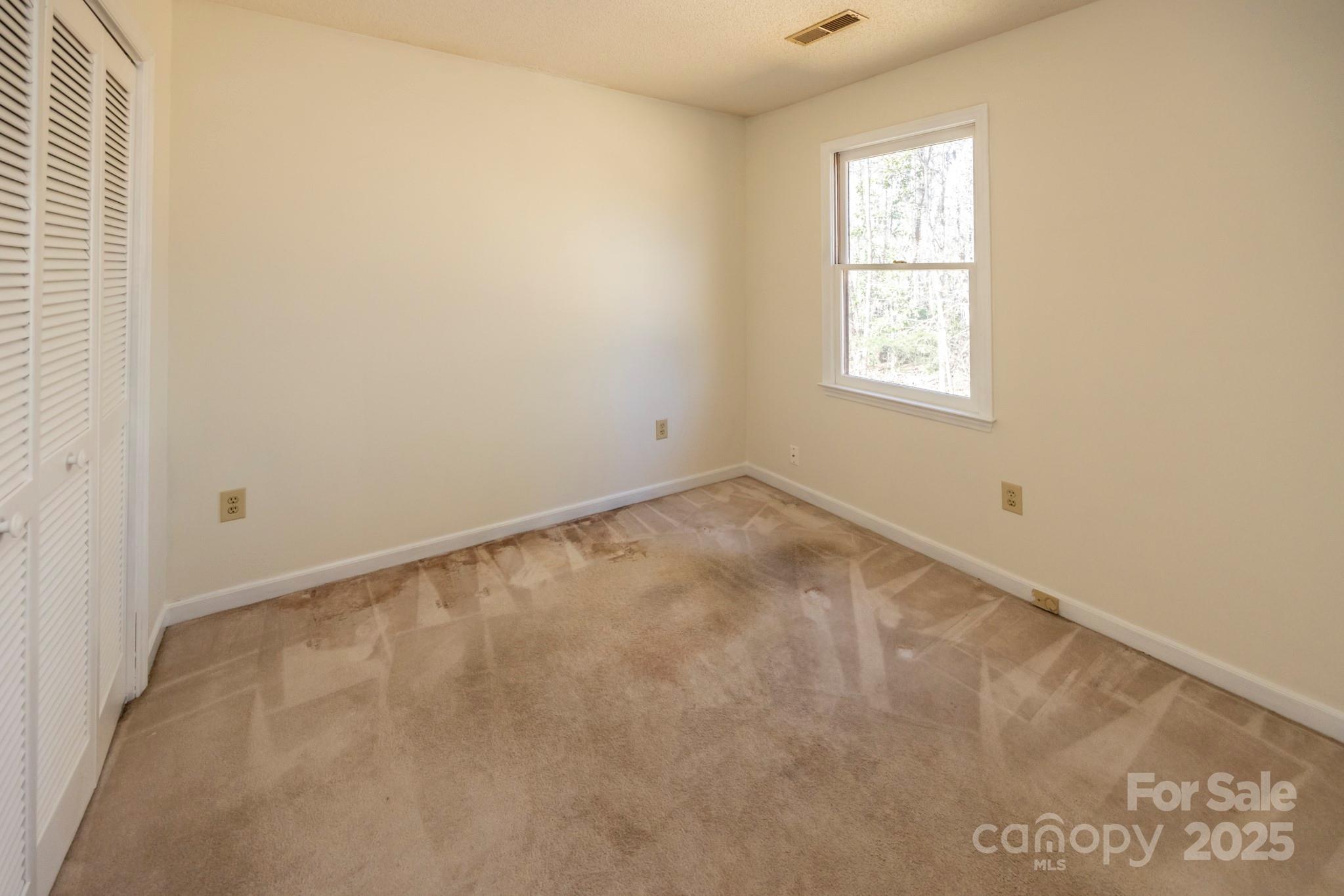 395 Thompson Road Rutherfordton, NC 28139 - Photo 17 of 25 an empty room with a window