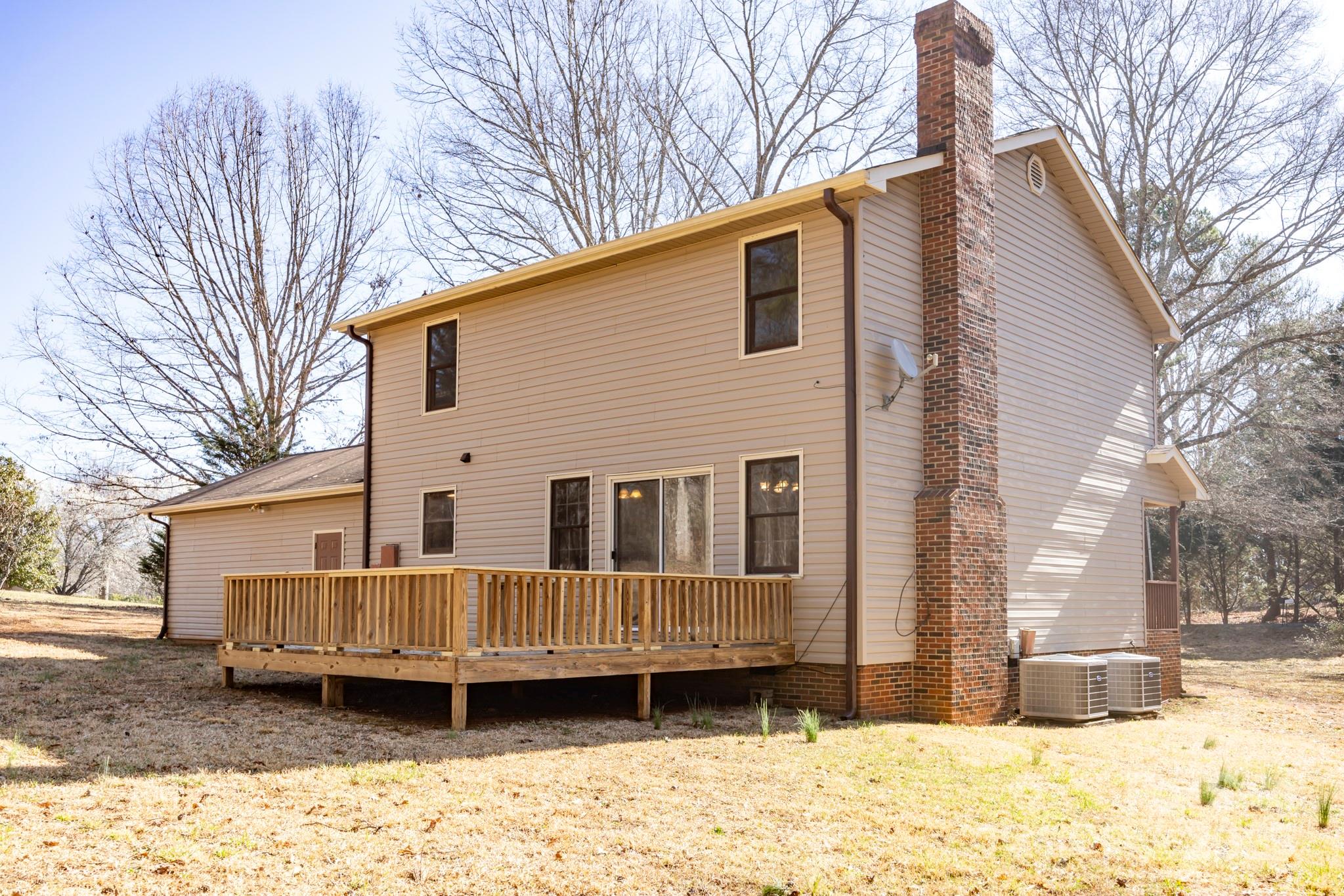395 Thompson Road Rutherfordton, NC 28139 - Photo 2 of 25 a front view of a house with a yard covered in snow