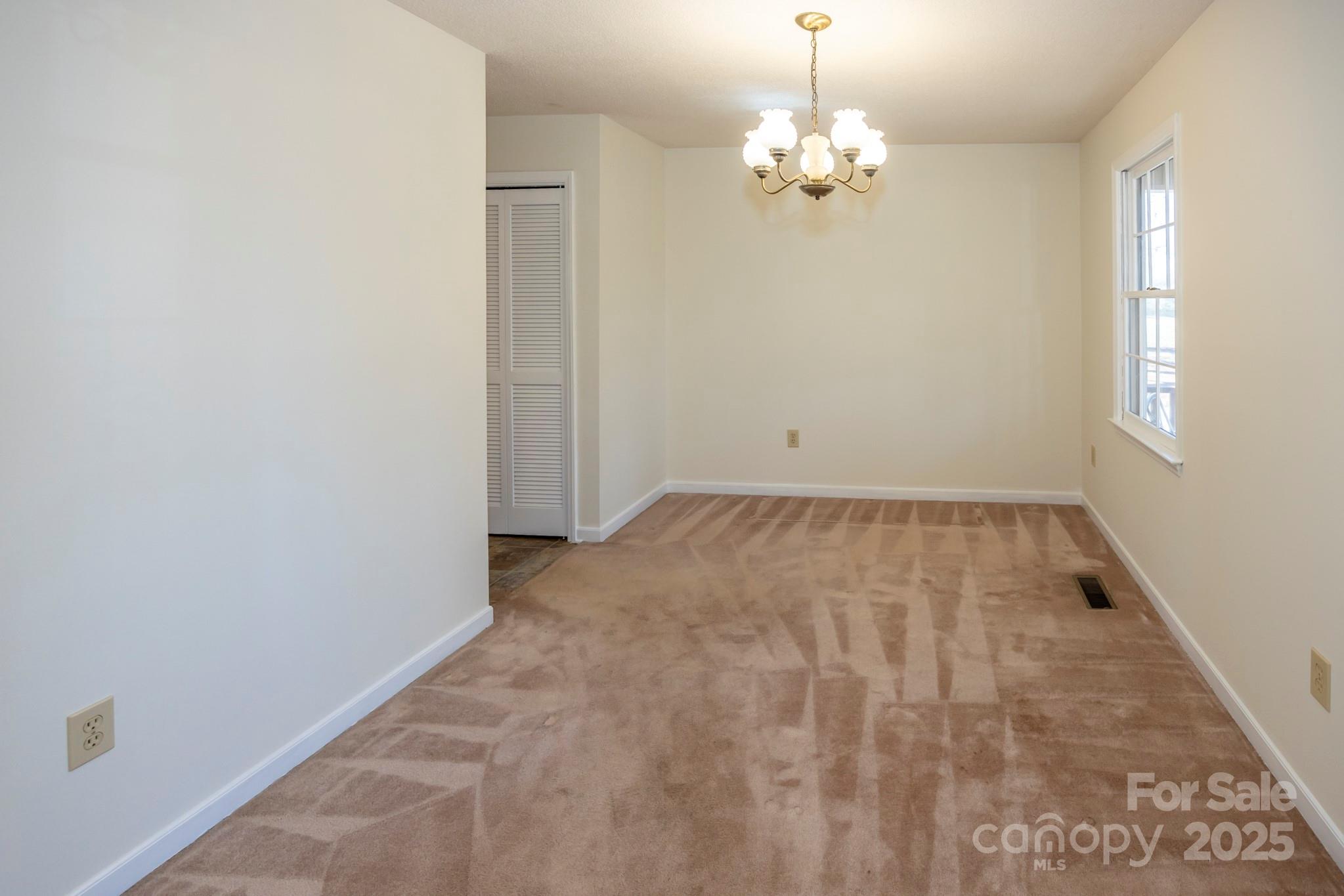 395 Thompson Road Rutherfordton, NC 28139 - Photo 10 of 25 en empty room with wooden floor