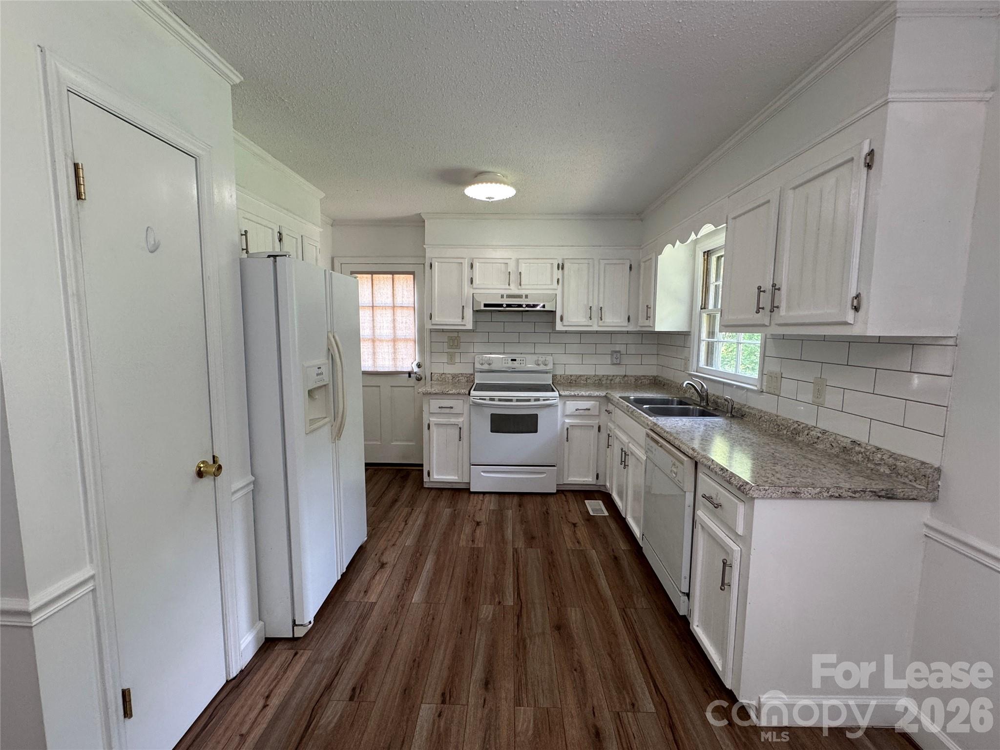 315 Pine Road Mount Holly, NC 28120 - Photo 4 of 21 a kitchen with a white stove top oven and refrigerator
