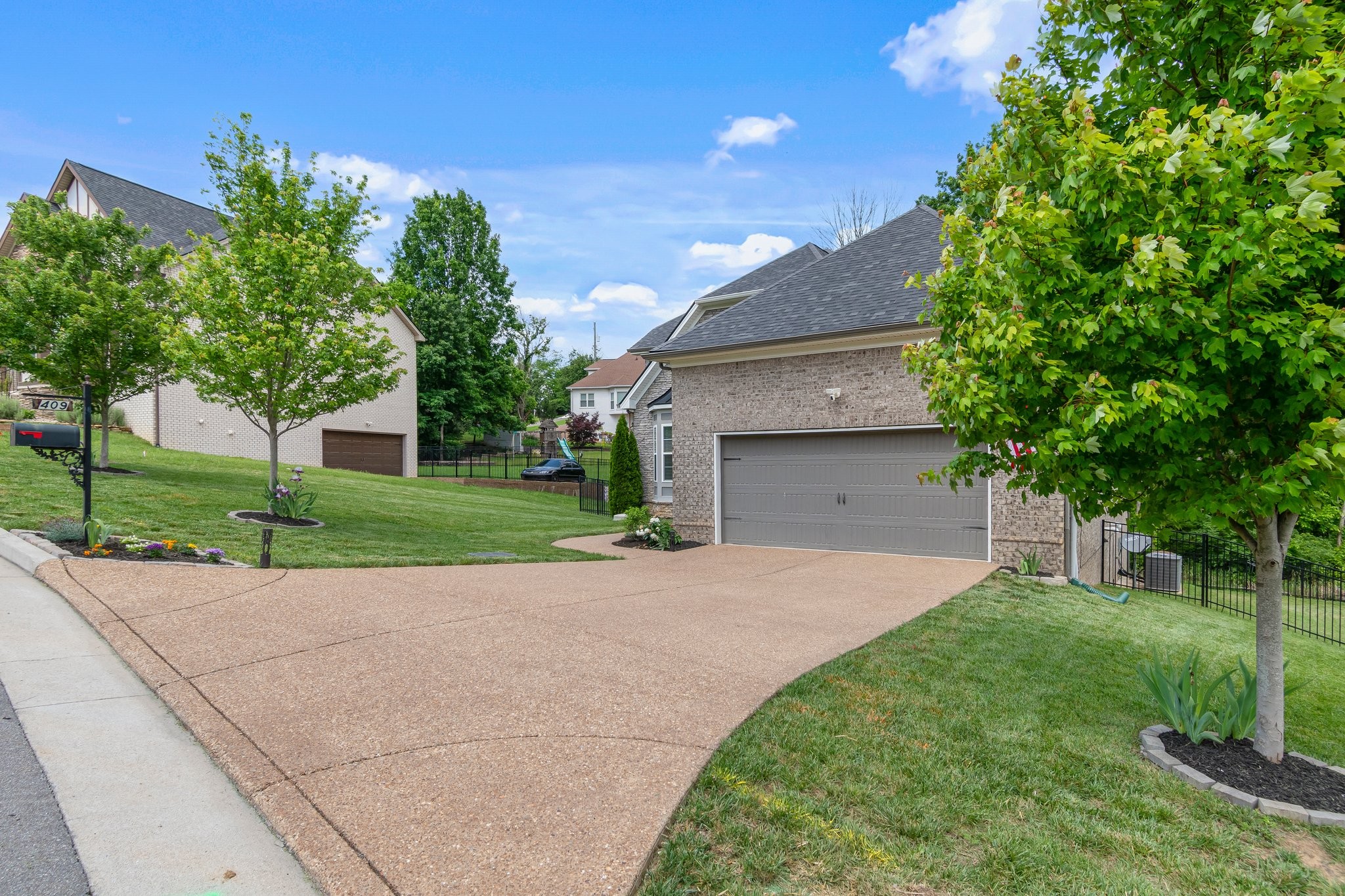 409 Eagle Ridge Nashville, TN 37209 - Photo 83 of 83 a front view of a house with a yard and a garage