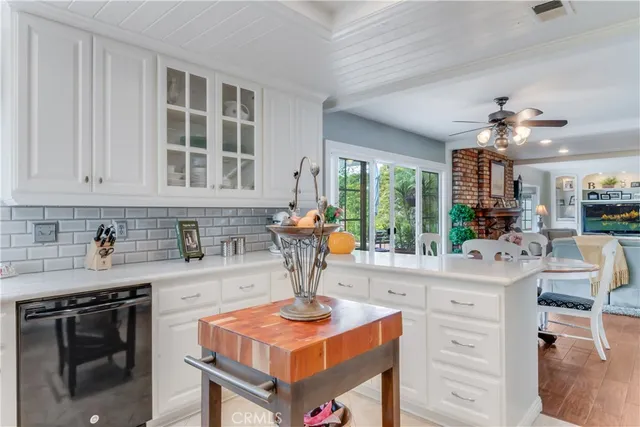 a kitchen with stainless steel appliances granite countertop a stove and a sink
