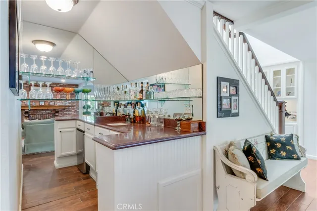 a view of living room with furniture and a potted plant