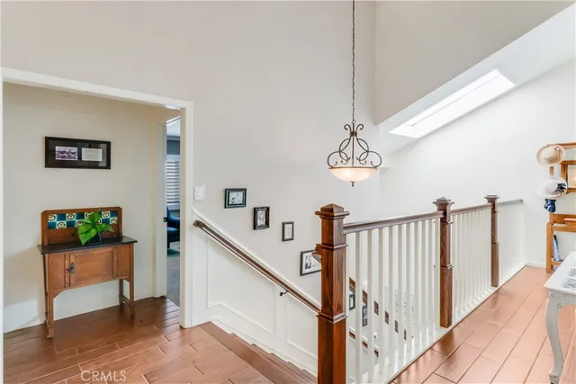 a view of a hallway with a livingroom and entryway