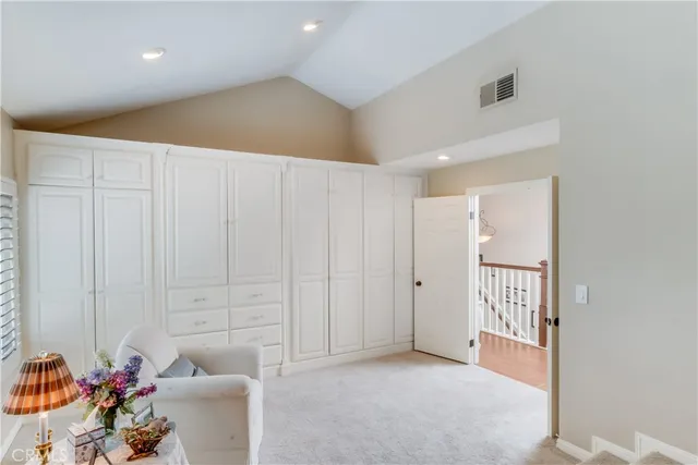a bathroom with a granite countertop shower mirror and a toilet