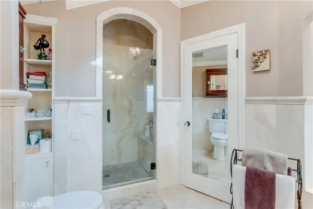 a bedroom with a bed and a lamp on table